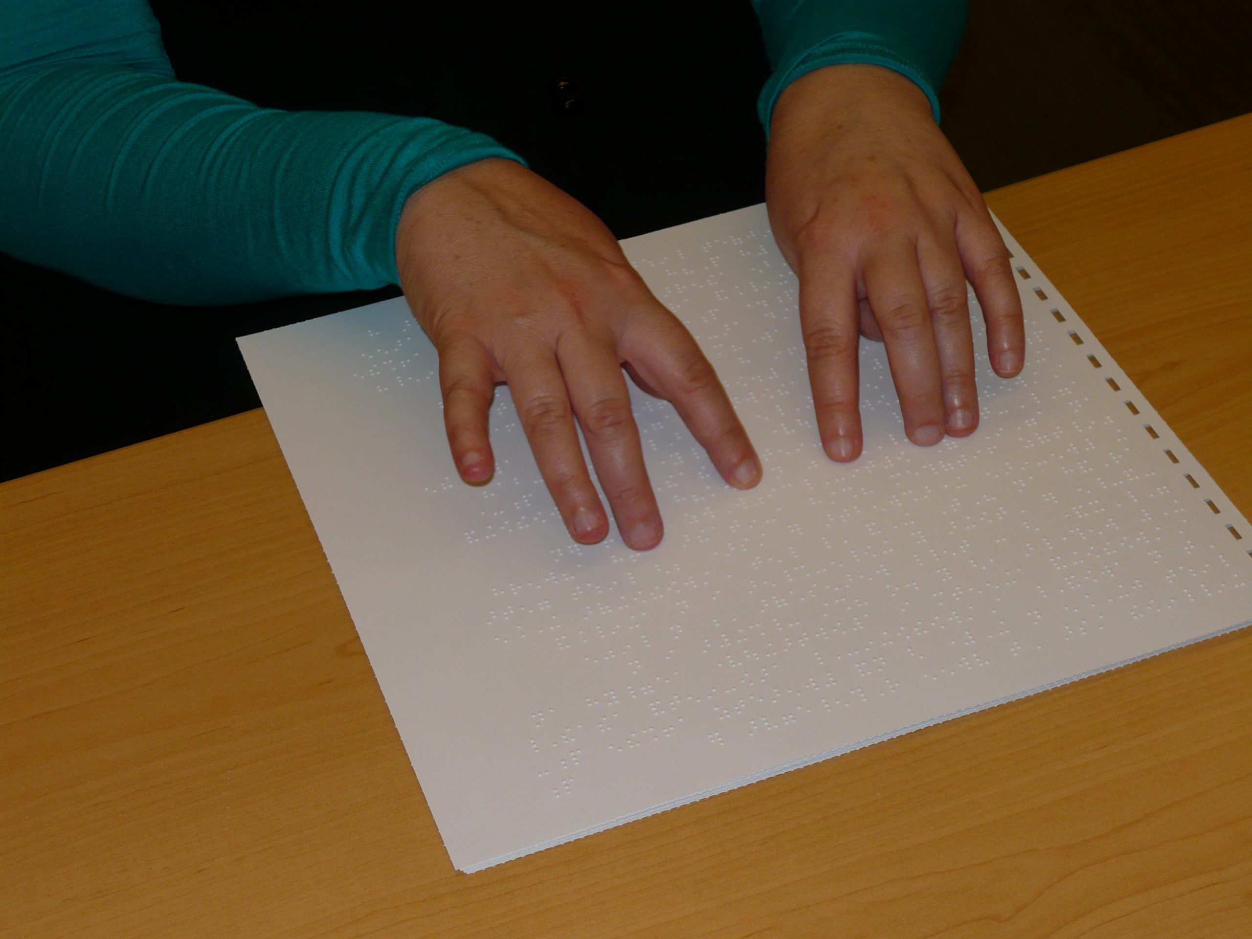 a person reading braille