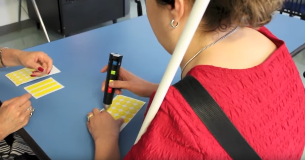 student being taught independent living skills at table